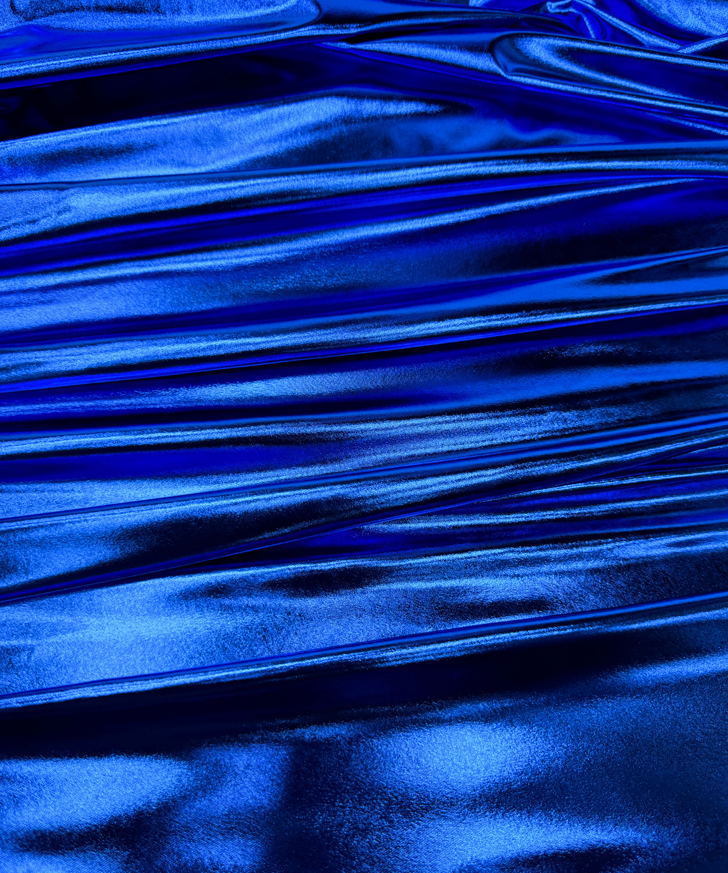 Close-up of metallic Royal Blue fabric. Royal Blue Metallic Stretch Foil Lame fabric