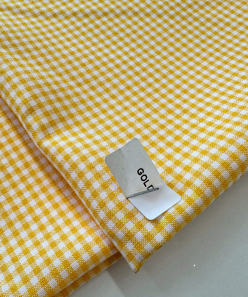 Gold and white checkered fabric. Gold gingham fabric. 